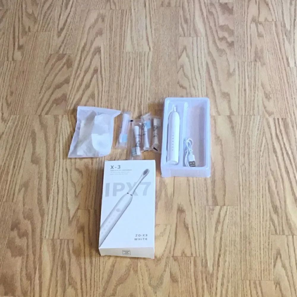 New stock, electric toothbrush with usb charger, 4 toothbrush heads, wall mount